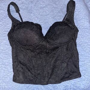 Black corset like top, size large and from the brand reoria.